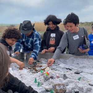 Warden middle school students explore how climate change affects water supply in the Columbia Basin using a model.