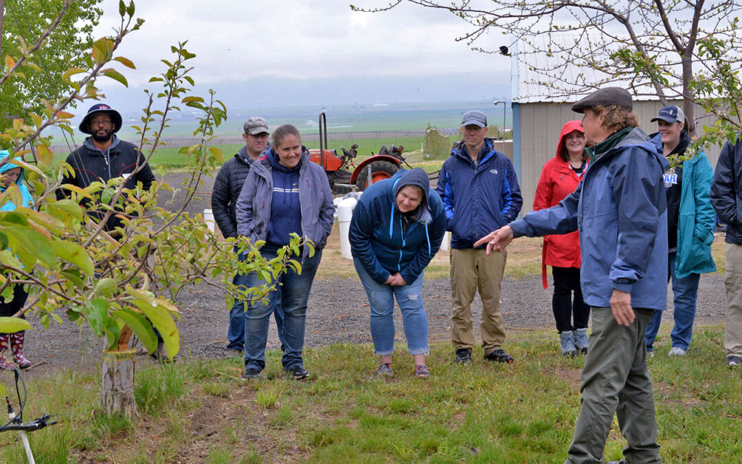 Farmer Jim Baird teaches participants about techniques for apple propagation.