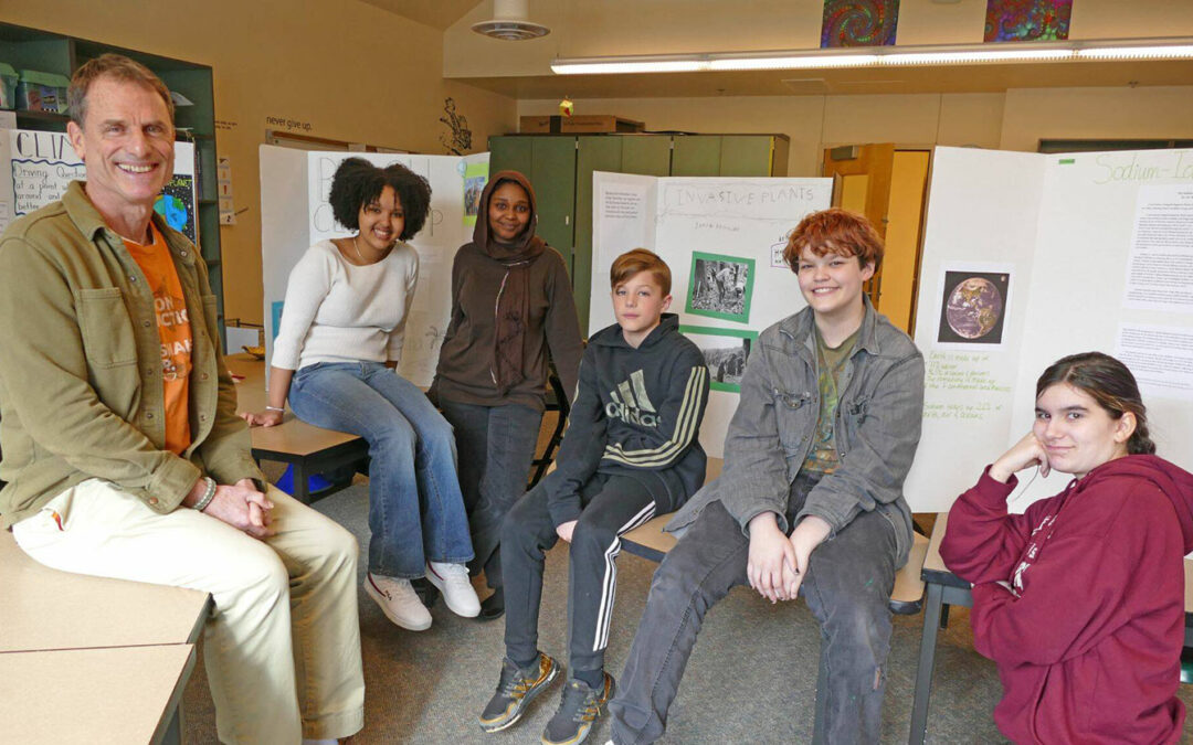 Bradley Barton with graduates of his Climate Crisis Solutions class