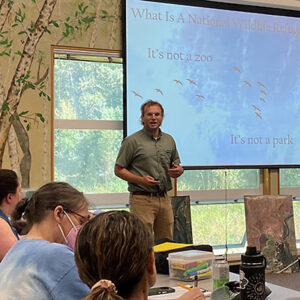 Davy Clark (US Fish and Wildlife Service) shares opportunities for students to engage with restoration and conservation efforts at the Billy Frank Jr. Nisqually National Wildlife Refuge