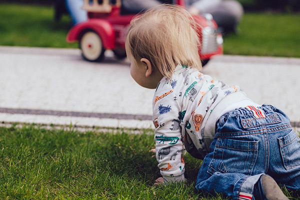 Baby playing in the grass