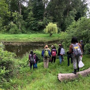 Students walking alongside the banks of Oxbow Lake, which is technically a part of the Snoqualmie River’s watercourse.