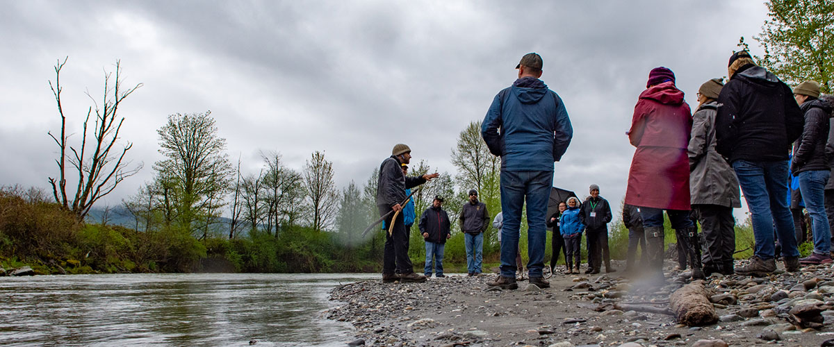 Teachers standing by river